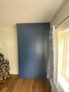 Alby blue wardrobe fitted in Stokesley where there was no level wall (straight on view)